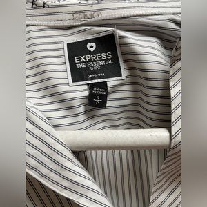 White women’s button down with black stripes, the Essential Shirt from Express